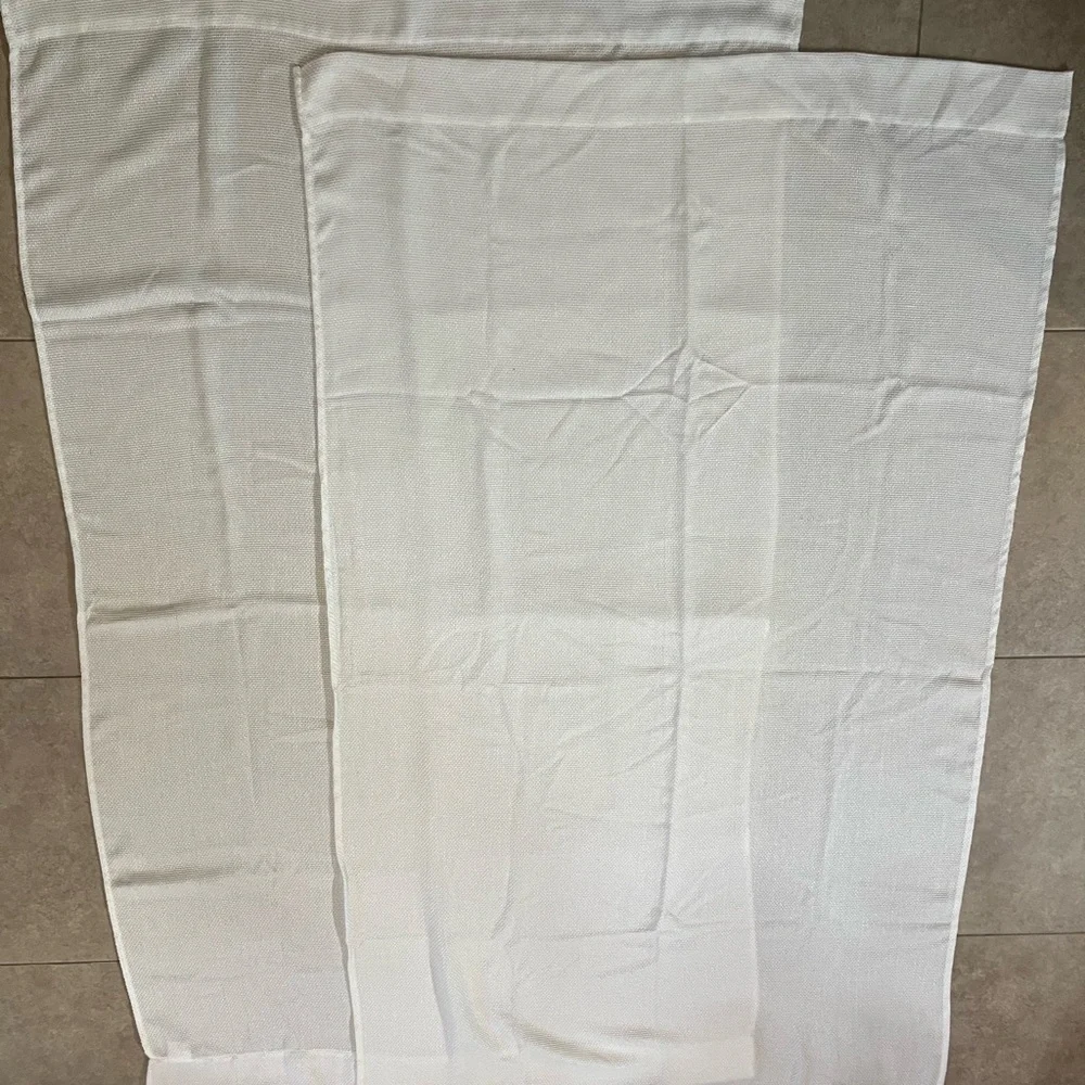 2 Panels Of White Textured Fabric Curtains Each are 63x36